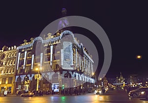 Evening city with New Year and Christmas decorations, Singer Company House 1902 on Nevsky Prospect. St. Petersburg. Russia