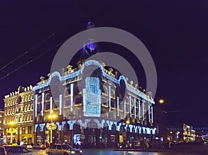 Evening city with New Year and Christmas decorations, Singer Company House 1902 on Nevsky Prospect. St. Petersburg. Russia