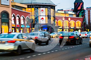 Evening city traffic in a giant metropolis.City light bokeh background.Defocused night traffic lights.