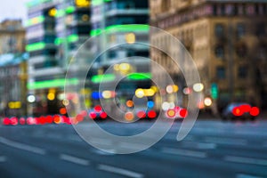 Evening city traffic in a giant metropolis.City light bokeh background.Defocused night traffic lights.