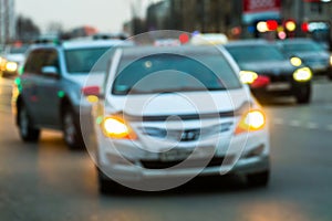 Evening city traffic in a giant metropolis.City light bokeh background.Defocused night traffic lights.