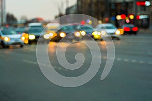 Evening city traffic in a giant metropolis.City light bokeh background.Defocused night traffic lights.