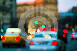 Evening city traffic in a giant metropolis.City light bokeh background.Defocused night traffic lights.