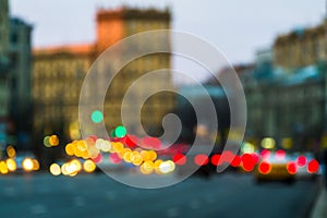 Evening city traffic in a giant metropolis.City light bokeh background.Defocused night traffic lights.