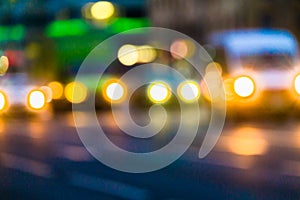 Evening city traffic in a giant metropolis.City light bokeh background.Defocused night traffic lights.