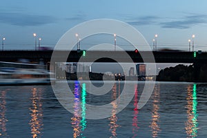 Evening city view of Moscow. Road bridges across the river. Moscow Channel at night.