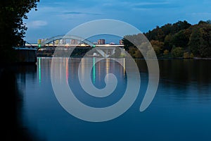 Evening city view of Moscow. Road bridges across the river. Moscow Channel at night.