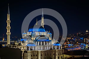 Evening cityscape with Yeni Cami or New Mosque after sunset in Istanbul Turkey