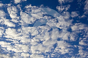 Evening clouds in the blue sky