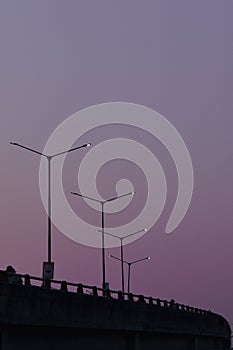 Evening / dawn view of a flyover with road light towers in Jammu and Kashmir India