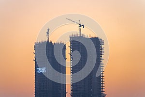 Evening dusk shot of Trump Towers under construction building skyscraper in gurgaon showing rapid growth of