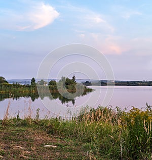 Evening dusk on summer valley lake. Natural seasonal, weather, countryside beauty concept and background scene