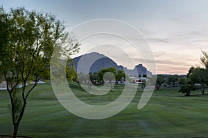 Evening falls over the Scottsdale Greenbelt Park and Camelback Mountain photo