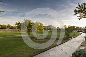 Evening falls over the Scottsdale Greenbelt Park and Camelback Mountain photo