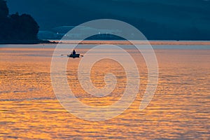 Evening fishing lake fisherman boat.