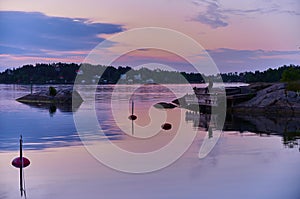 Evening fishing one beautiful evening at a jetty in one of Vaxholm`s bays