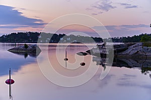 Evening fishing one beautiful evening at a jetty in one of Vaxholm`s bays