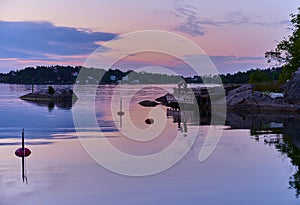 Evening fishing one beautiful evening at a jetty in one of Vaxholm`s bays