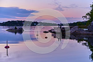 Evening fishing one beautiful evening at a jetty in one of Vaxholm`s bays