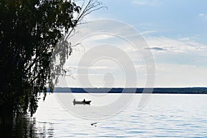 Evening fishing at sunset on lake