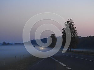 Evening fog on road in autumn, Lithuania