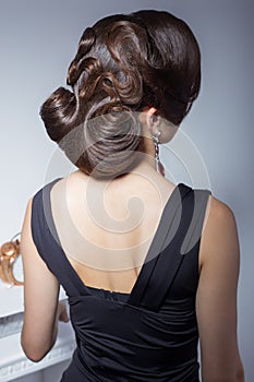 Evening hairstyle, beautiful elegant attractive girl in evening dress