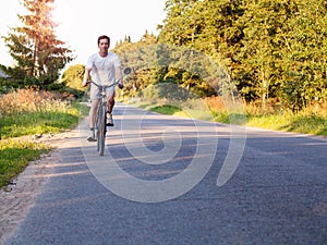 Evening journey. Man riding a bike