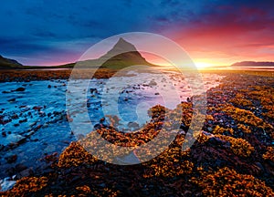 Evening Kirkjufell volcano the coast of Snaefellsnes peninsula. Location Kirkjufellsfoss waterfall