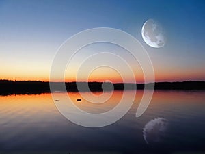 Evening lake under the Moon