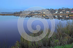 Evening on the lake in the village