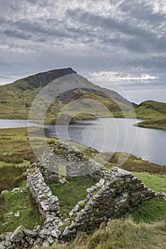 Evening landscape image of Llyn y Dywarchen lake in Autumn in Sn