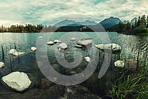 Evening landscape with lake and mountains