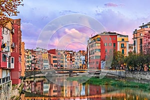 Evening landscape of the Old Town of Girona with pink clouds
