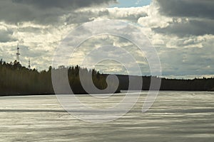 Evening landscape with water surface of the lake with the forest