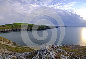 Evening light on the Ceredigion cliffs and Cardigan Island from Mwnt, Wales