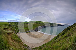 Evening light on the Ceredigion cliffs and Cardigan Island from Mwnt, Wales