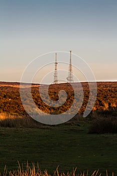 Evening light on hilltop with radio masts