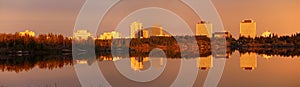Yellowknife Landscape Panorama, Evening Light mirrors Downtown in Frame Lake, Northwest Territories, Canada photo