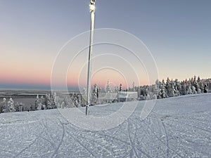 Evening mood and colorful sunset seen from the slopes in Levi