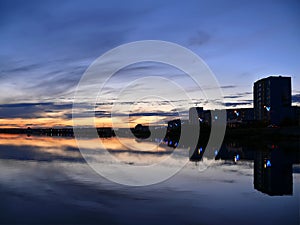 Evening Nadim on the river Nadym. Sunset over the city.