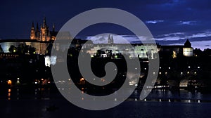 Summer night view of Charles Bridge over the Vltava in the historical part of Prague