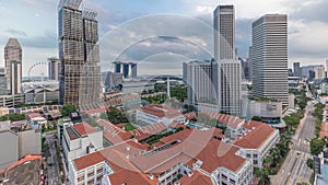 Evening panorama with Marina Bay area and skyscrapers city skyline aerial timelapse.