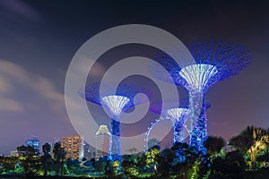 Evening Panorama skyline of Gardens by the Bay and Suntec City in Singapore