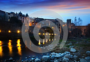 Evening photo of medieval town with bridge. Besalu