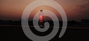 Evening picture with mineral water bottle sunset time