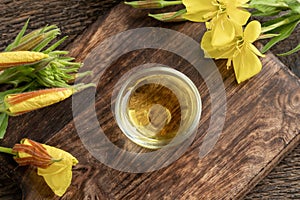 Evening primrose oil in a bowl, top view