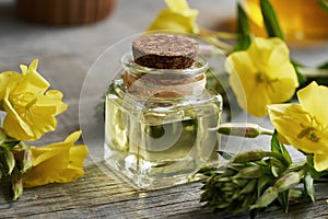 Evening primrose oil with fresh blossoms