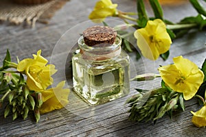 Evening primrose oil in a glass bottle on a table