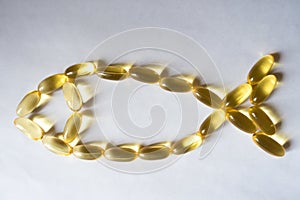 Evening primrose oil supplement capsules in a fish shape