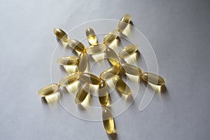 Evening primrose oil supplement capsules in a sun shape